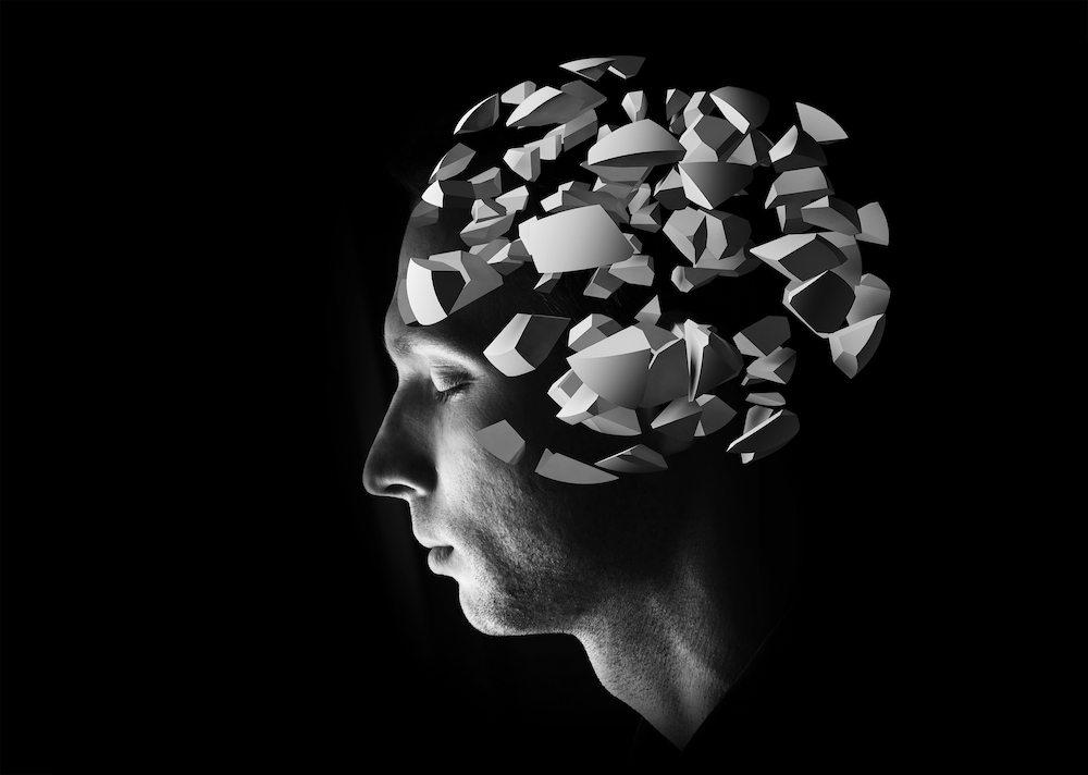 Male head profile with 3d explosion brain fragments on black background